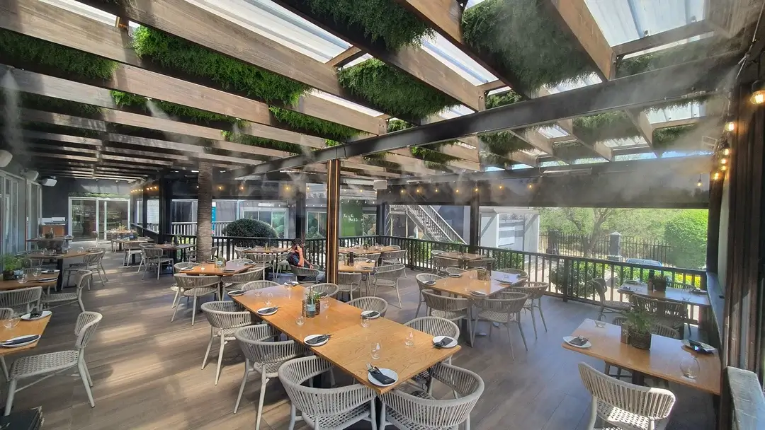 Restaurant terrace with an outdoor mist cooling system